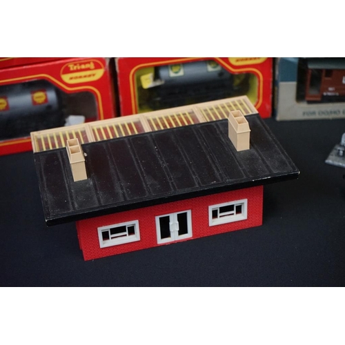 128 - Quantity of OO gauge model railway to include 9 x boxed items of rolling stock, various track, plast... 