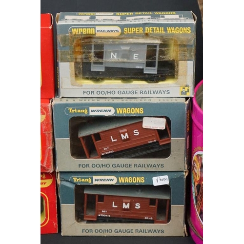 128 - Quantity of OO gauge model railway to include 9 x boxed items of rolling stock, various track, plast... 