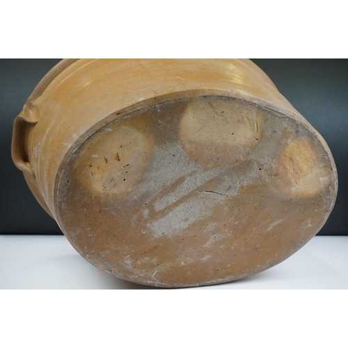 108 - Large 19th Century Victorian salt glazed Dairy Bowl of oval form with twin handles. Measures 23 x 54... 