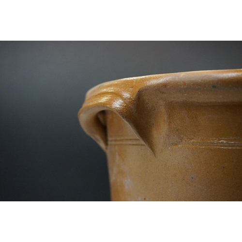 108 - Large 19th Century Victorian salt glazed Dairy Bowl of oval form with twin handles. Measures 23 x 54... 