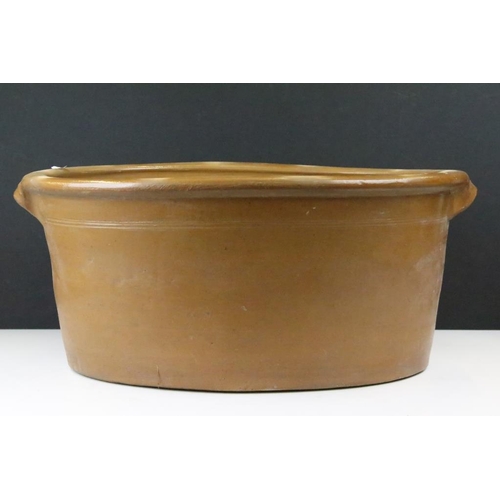108 - Large 19th Century Victorian salt glazed Dairy Bowl of oval form with twin handles. Measures 23 x 54... 