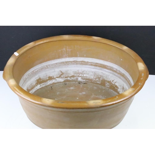 108 - Large 19th Century Victorian salt glazed Dairy Bowl of oval form with twin handles. Measures 23 x 54... 