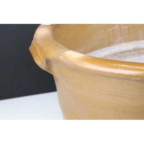 108 - Large 19th Century Victorian salt glazed Dairy Bowl of oval form with twin handles. Measures 23 x 54... 