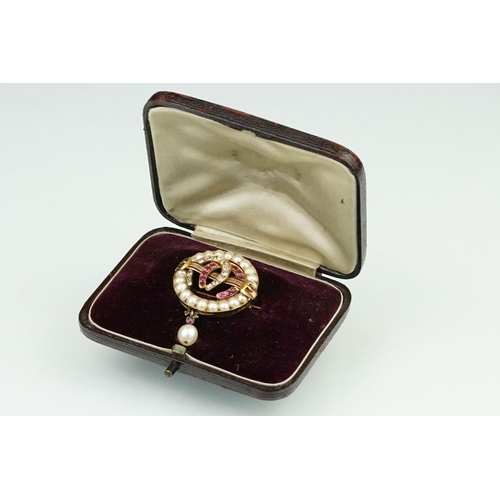 1 - 19th century ruby, diamond and pearl brooch, the two central entwined horse shoe motifs set with gra... 