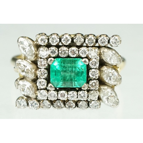 10 - Emerald and diamond 18ct yellow and white gold cluster ring, the central emerald cut emerald measuri... 