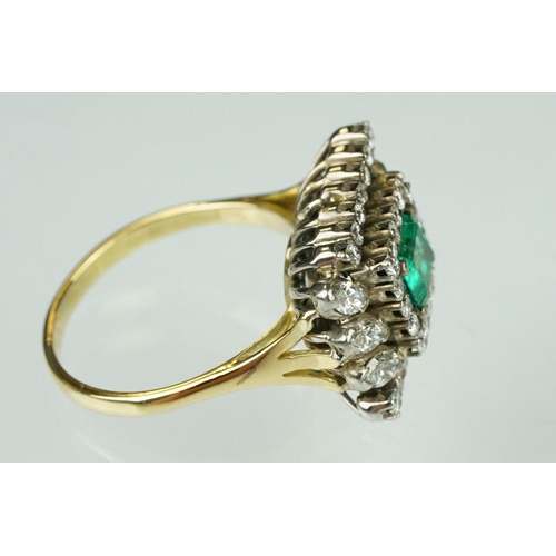 10 - Emerald and diamond 18ct yellow and white gold cluster ring, the central emerald cut emerald measuri... 