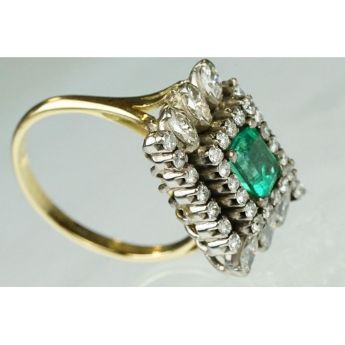 10 - Emerald and diamond 18ct yellow and white gold cluster ring, the central emerald cut emerald measuri... 