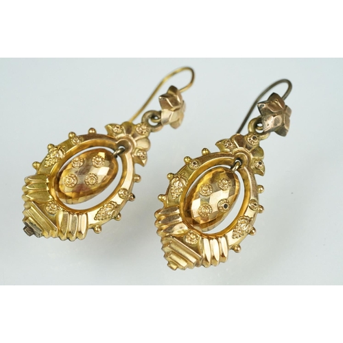 106 - Pair of Victorian yellow metal drop earrings, the stepped marquise earrings with bead and vine and b... 