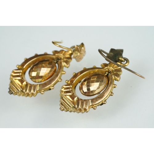 106 - Pair of Victorian yellow metal drop earrings, the stepped marquise earrings with bead and vine and b... 