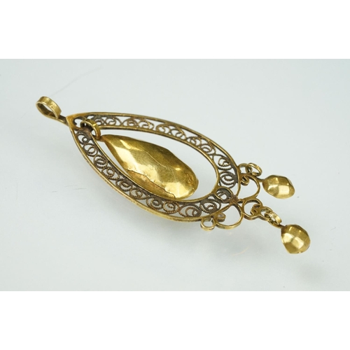 108 - 19th century yellow metal filigree pendant, openwork filigree surround, oval faceted dropper, two ci... 