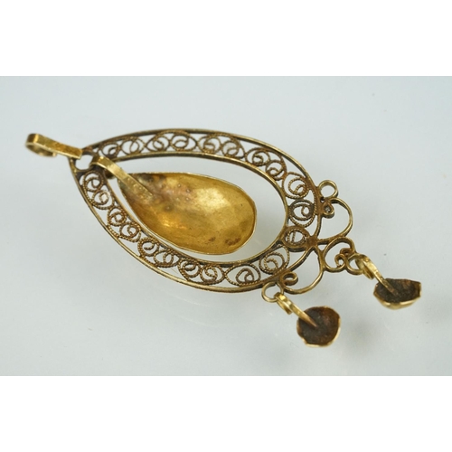 108 - 19th century yellow metal filigree pendant, openwork filigree surround, oval faceted dropper, two ci... 