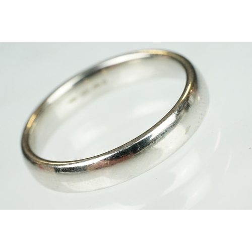 110 - Platinum wedding band, D shank, plain polished, width approx 4mm, ring size Q