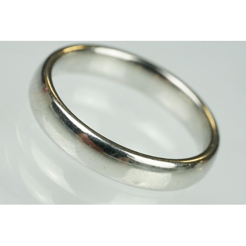 110 - Platinum wedding band, D shank, plain polished, width approx 4mm, ring size Q