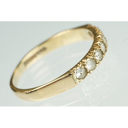 125 - Paste 9ct yellow gold seven stone dress ring, size O½; a paste 9ct yellow gold ring, crossover shoul... 