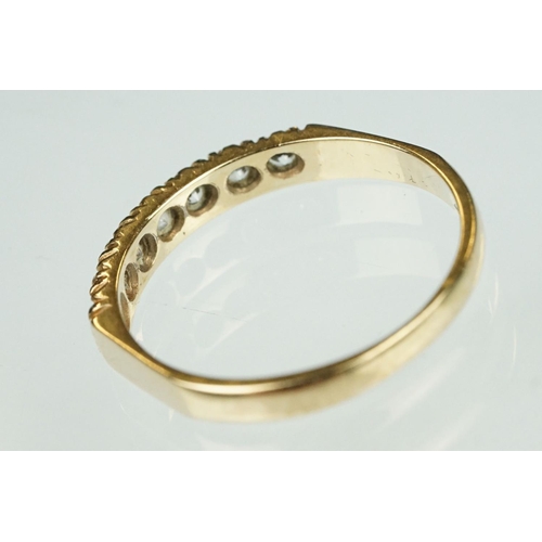 125 - Paste 9ct yellow gold seven stone dress ring, size O½; a paste 9ct yellow gold ring, crossover shoul... 