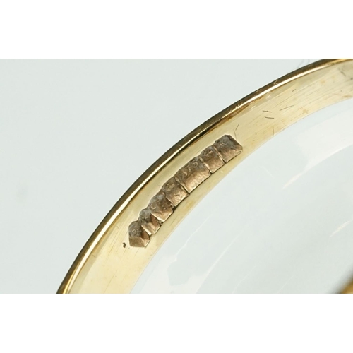 125 - Paste 9ct yellow gold seven stone dress ring, size O½; a paste 9ct yellow gold ring, crossover shoul... 