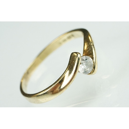 125 - Paste 9ct yellow gold seven stone dress ring, size O½; a paste 9ct yellow gold ring, crossover shoul... 