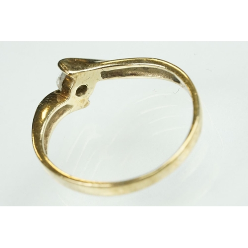 125 - Paste 9ct yellow gold seven stone dress ring, size O½; a paste 9ct yellow gold ring, crossover shoul... 