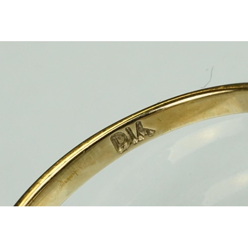 125 - Paste 9ct yellow gold seven stone dress ring, size O½; a paste 9ct yellow gold ring, crossover shoul... 