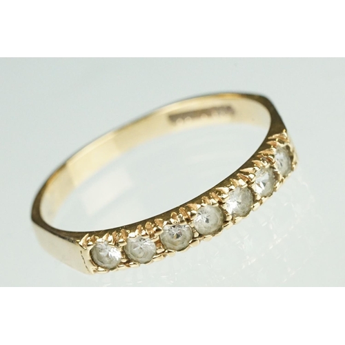 125 - Paste 9ct yellow gold seven stone dress ring, size O½; a paste 9ct yellow gold ring, crossover shoul... 