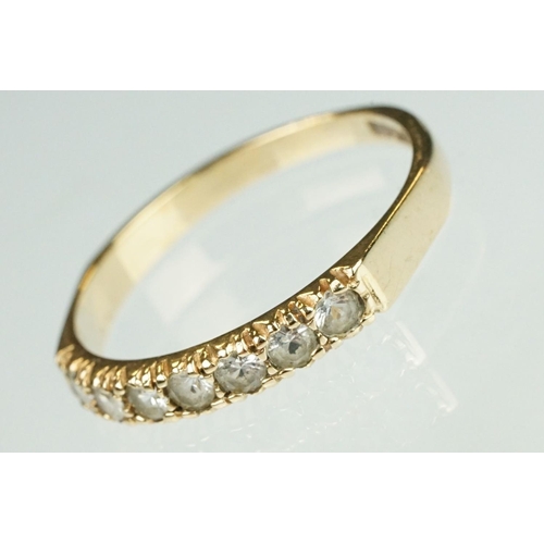 125 - Paste 9ct yellow gold seven stone dress ring, size O½; a paste 9ct yellow gold ring, crossover shoul... 