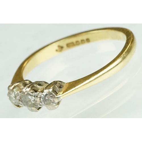 138 - Diamond three stone 18ct yellow gold ring, three graduated round brilliant cut diamonds, claw illusi... 