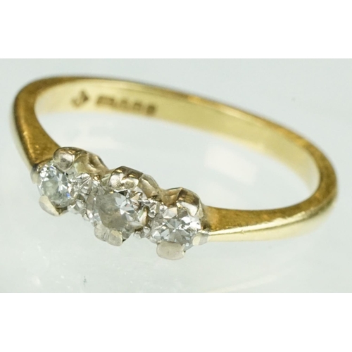 138 - Diamond three stone 18ct yellow gold ring, three graduated round brilliant cut diamonds, claw illusi... 