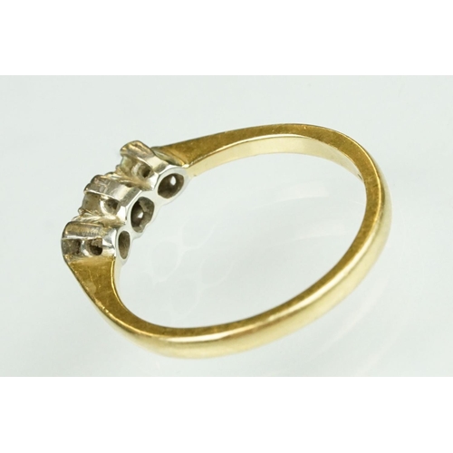 138 - Diamond three stone 18ct yellow gold ring, three graduated round brilliant cut diamonds, claw illusi... 