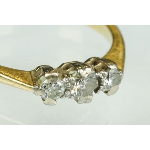 138 - Diamond three stone 18ct yellow gold ring, three graduated round brilliant cut diamonds, claw illusi... 