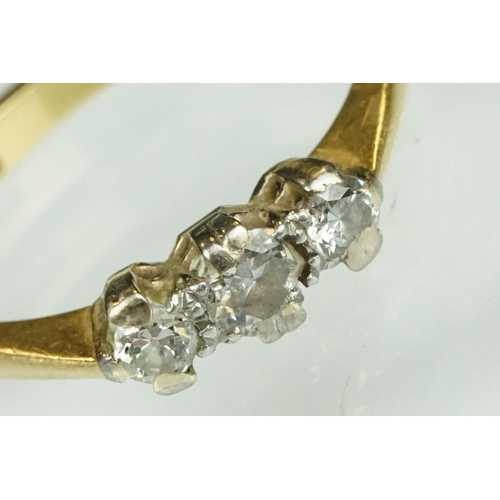 138 - Diamond three stone 18ct yellow gold ring, three graduated round brilliant cut diamonds, claw illusi... 