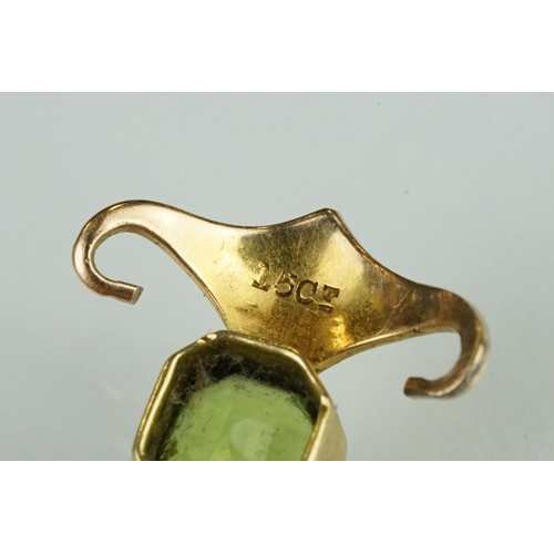 144 - Edwardian 15ct gold peridot and pearl pendant together with a yellow metal filigree bracelet with sp... 