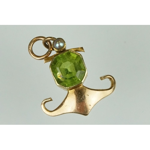 144 - Edwardian 15ct gold peridot and pearl pendant together with a yellow metal filigree bracelet with sp... 