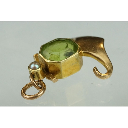 144 - Edwardian 15ct gold peridot and pearl pendant together with a yellow metal filigree bracelet with sp... 