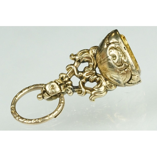 15 - 19th century citrine yellow metal fob seal, the intaglio citrine seal depicting a sunflower and the ... 