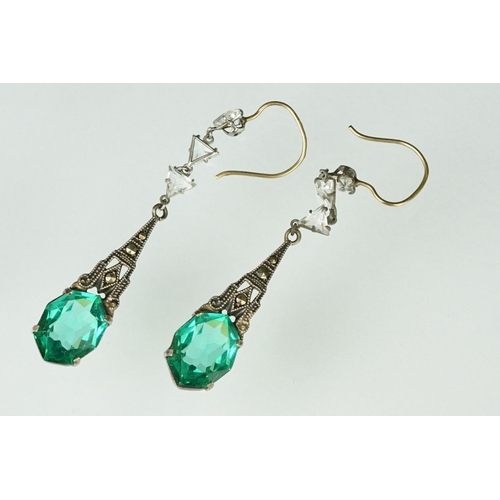 152 - Pair of 1920s Art Deco paste drop earrings having emerald coloured stones with marcasite set mounts ... 