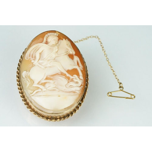 178 - Shell cameo 9ct rose gold brooch, the cameo depicting a Roman centurion riding a horse, rubover set,... 