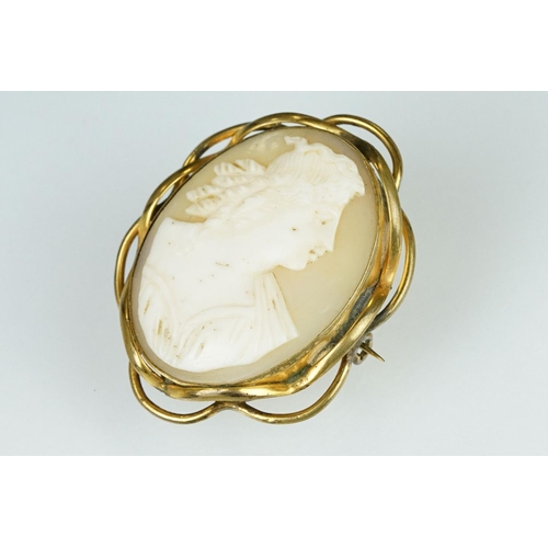 179 - Shell cameo 9ct yellow gold brooch depicting the The Graces; a 19th century shell cameo yellow metal... 