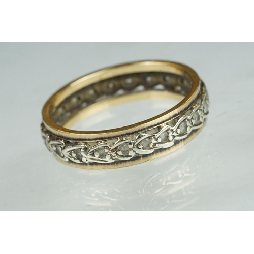 199 - Paste set yellow and white metal eternity ring, width approx 5.5mm, ring size U½