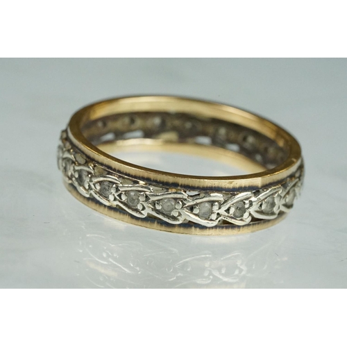 199 - Paste set yellow and white metal eternity ring, width approx 5.5mm, ring size U½