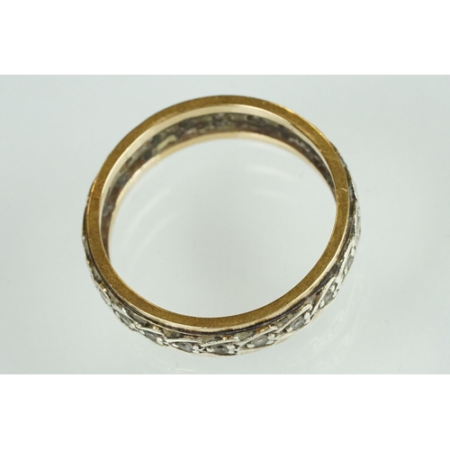 199 - Paste set yellow and white metal eternity ring, width approx 5.5mm, ring size U½