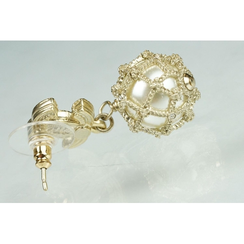 20 - Pair of Chanel costume jewellery earrings having crossed C's to the heads set with simulated pearls ... 