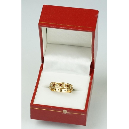 201 - Garnet and white stone 9ct yellow gold eternity ring, ring size M½, width approx 4.5mm; two ladies y... 