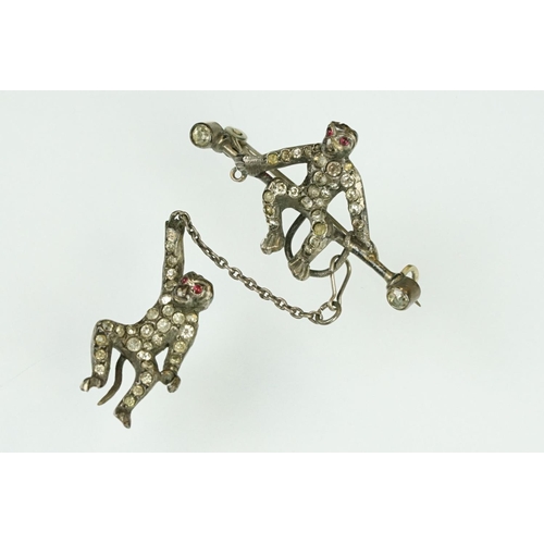 21 - 19th century paste silver brooch modelled as a monkey on a trapeze bar, suspending another monkey, f... 