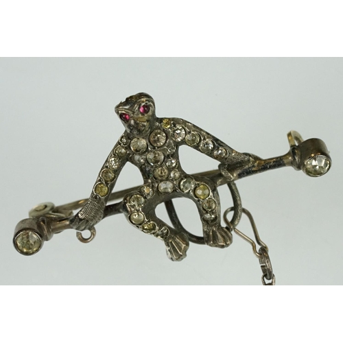 21 - 19th century paste silver brooch modelled as a monkey on a trapeze bar, suspending another monkey, f... 