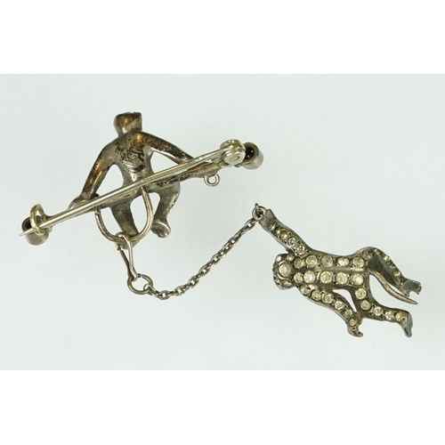 21 - 19th century paste silver brooch modelled as a monkey on a trapeze bar, suspending another monkey, f... 