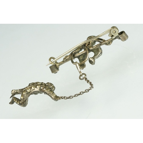 21 - 19th century paste silver brooch modelled as a monkey on a trapeze bar, suspending another monkey, f... 