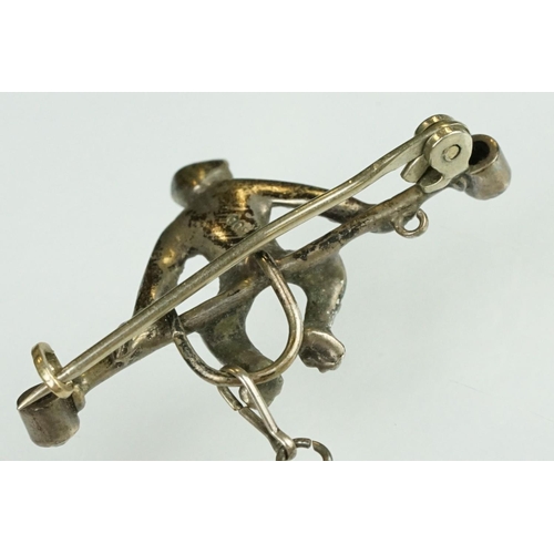 21 - 19th century paste silver brooch modelled as a monkey on a trapeze bar, suspending another monkey, f... 