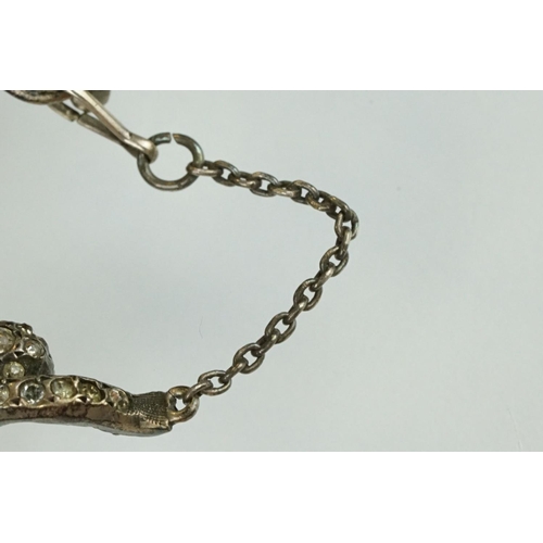 21 - 19th century paste silver brooch modelled as a monkey on a trapeze bar, suspending another monkey, f... 