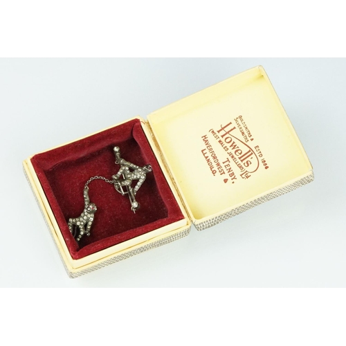 21 - 19th century paste silver brooch modelled as a monkey on a trapeze bar, suspending another monkey, f... 