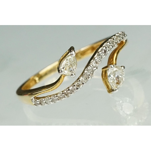 39 - Diamond 14ct yellow gold ring, two pear shaped diamonds, claw set, dimensions approx 2.5mm x 3.5mm, ... 